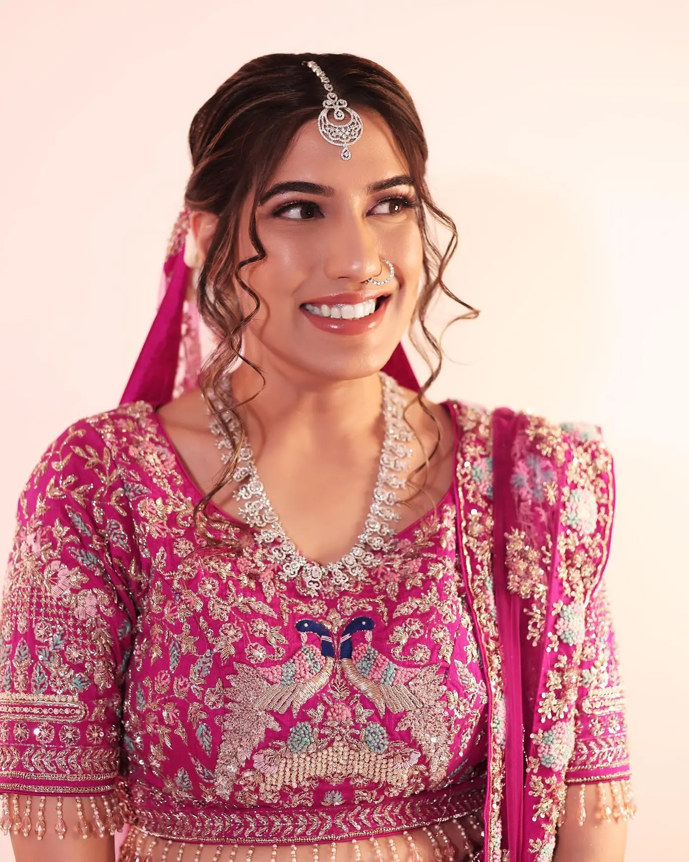 Pink Lehenga, Peacock Embroidery. Bridal makeup by Madhu Gupta at MG Makeovers, Gurugram